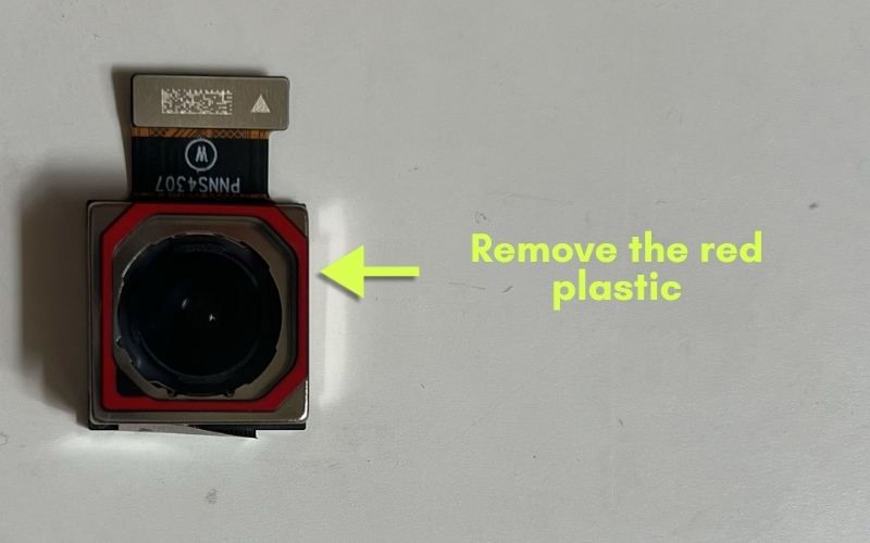 Camera replacement showing removal of the red protective lining